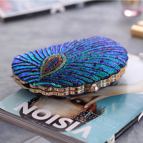 Astrid | Clutch rígido con pedrería y motivo de pavo real