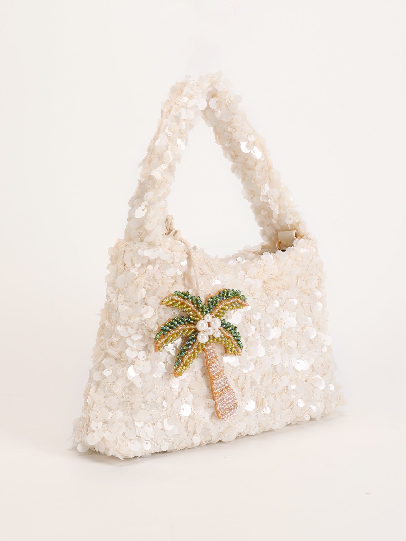 Iza | Bolso de lentejuelas con colgante de palmera